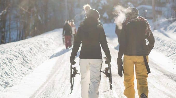 2 skiers walking