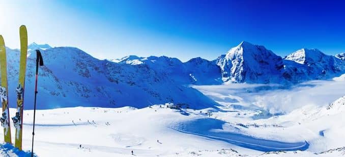 snowy mountains with skis